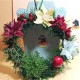 Coronita rotunda de craciun cu brad artificial, flori craciunite si ornament bobite. Marime 20 cm.