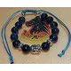 Bratara sodalit cu margele metalice Budha. Confectionat pe sarma siliconata , margele  6 mm sodalit cu margele metalice argintii budha si  distantiert argint tibetan. Inchizatoare snur cerat. Marime cca 18-24 cm.