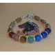 Bratara 7 chakre cu accesorii placate cu argint. Bratara pe elastic sau sarma siliconata cu incuietoare lobster placat cu argint, din diferite margele semipretioase 8 sau 6 mm si 7 chakre: carneol, jad portocaliu, ochi de tigru, aventurin verde, jasp impe